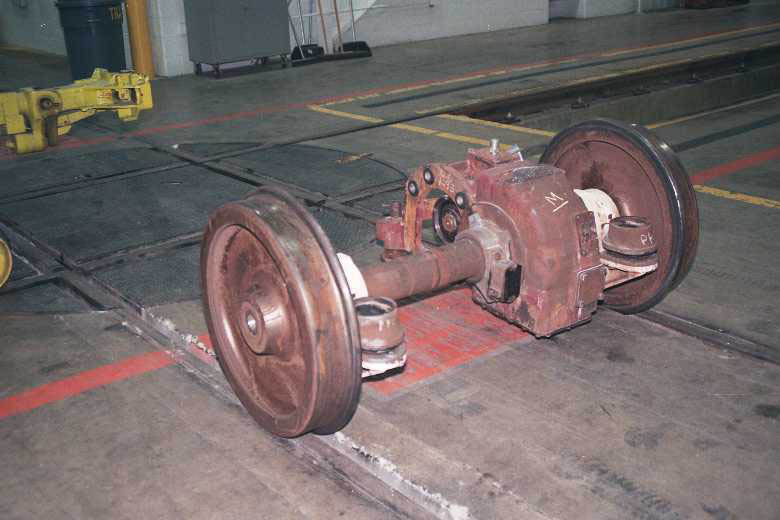 Wheel/Axle Unit and Turntable for Maneuvering